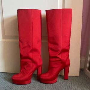 Red knee high heeled boots